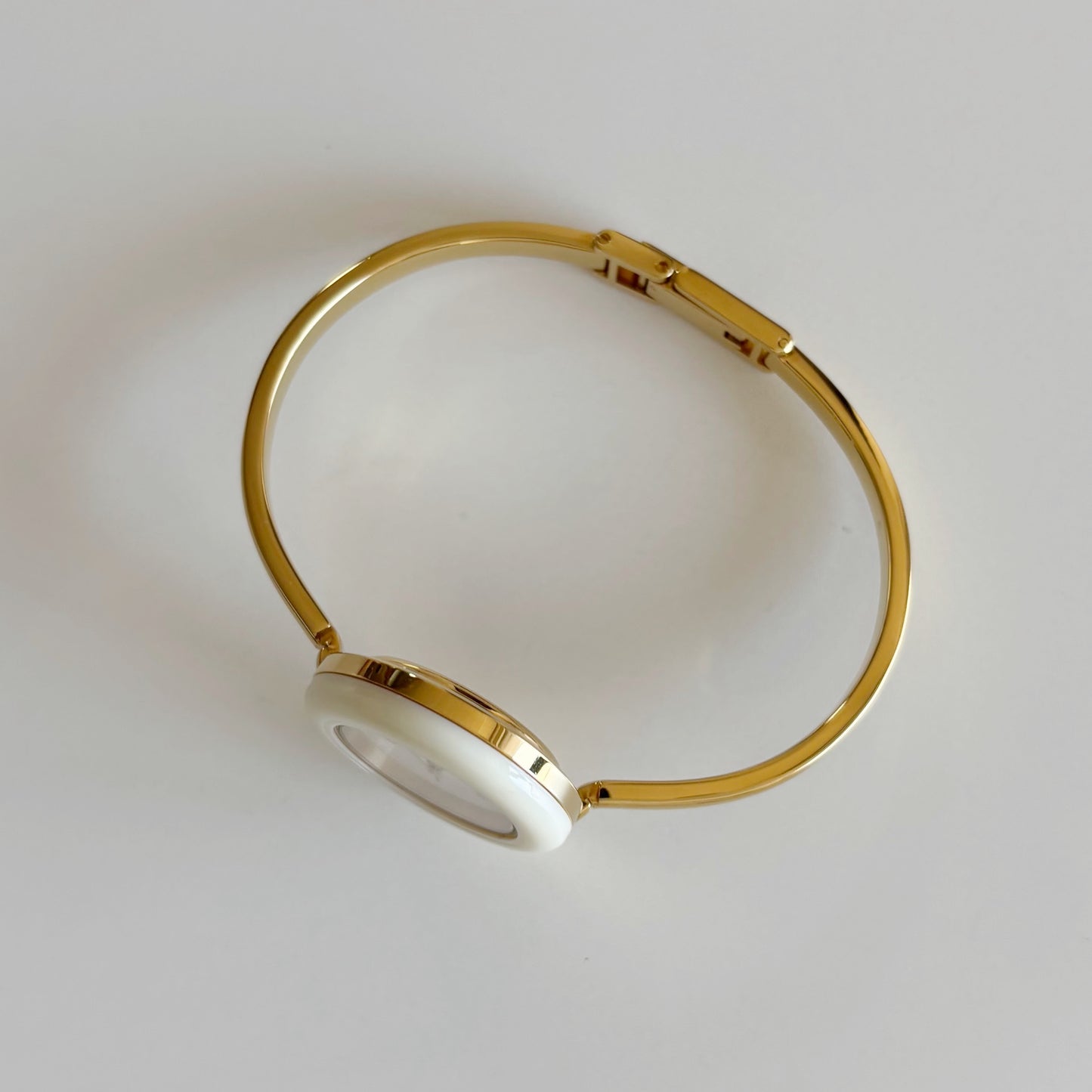 Gucci 1980s Interchangeable Bezel Gold Plated Bangle Watch with 12 bezels, case