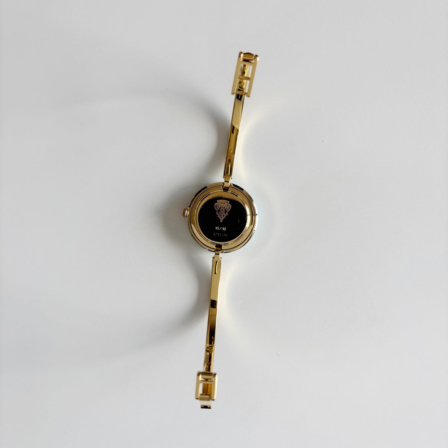 Gucci 1990s Interchangeable Bezel Gold Plated Bangle Watch with 12 bezels, case
