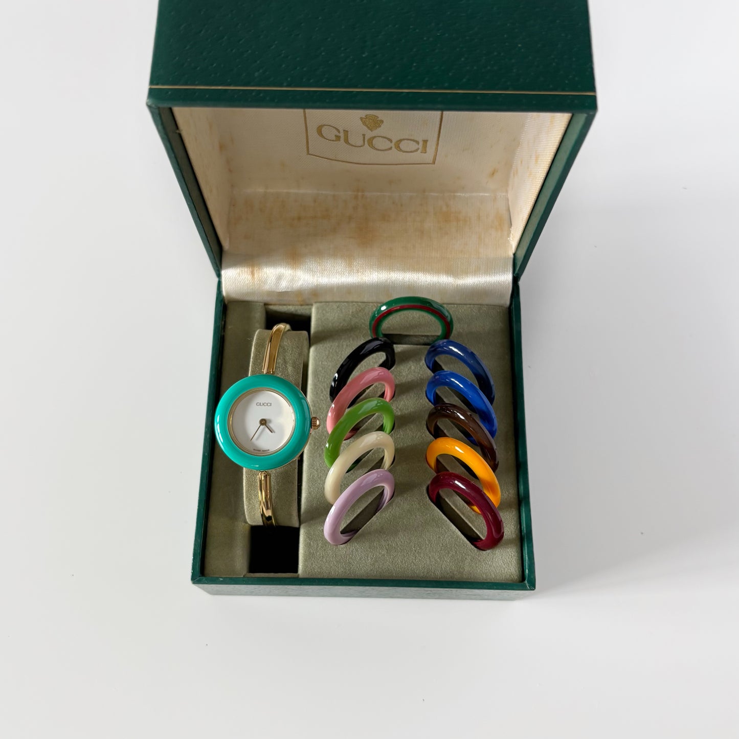 Gucci 1990s Interchangeable Bezel Gold Plated Bangle Watch with 12 bezels, case