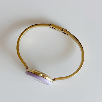 Gucci 1990s Interchangeable Bezel Gold Plated Bangle Watch with 12 bezels, case