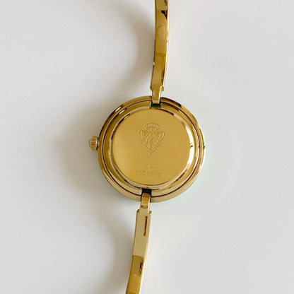 Gucci 1990s Interchangeable Bezel Gold Plated Bangle Watch with 12 bezels, case (Small)