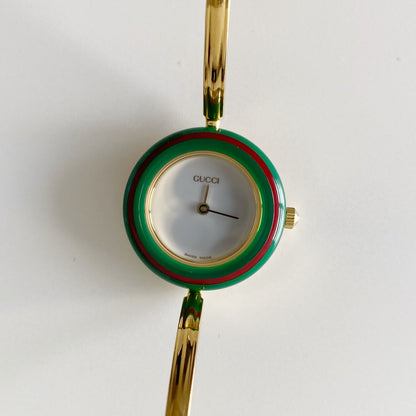 Gucci 1990s Interchangeable Bezel Gold Plated Bangle Watch with 12 bezels, case
