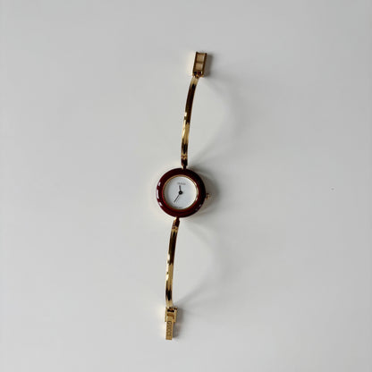 Gucci 1990s Interchangeable Bezel Gold Plated Bangle Watch with 12 bezels, case