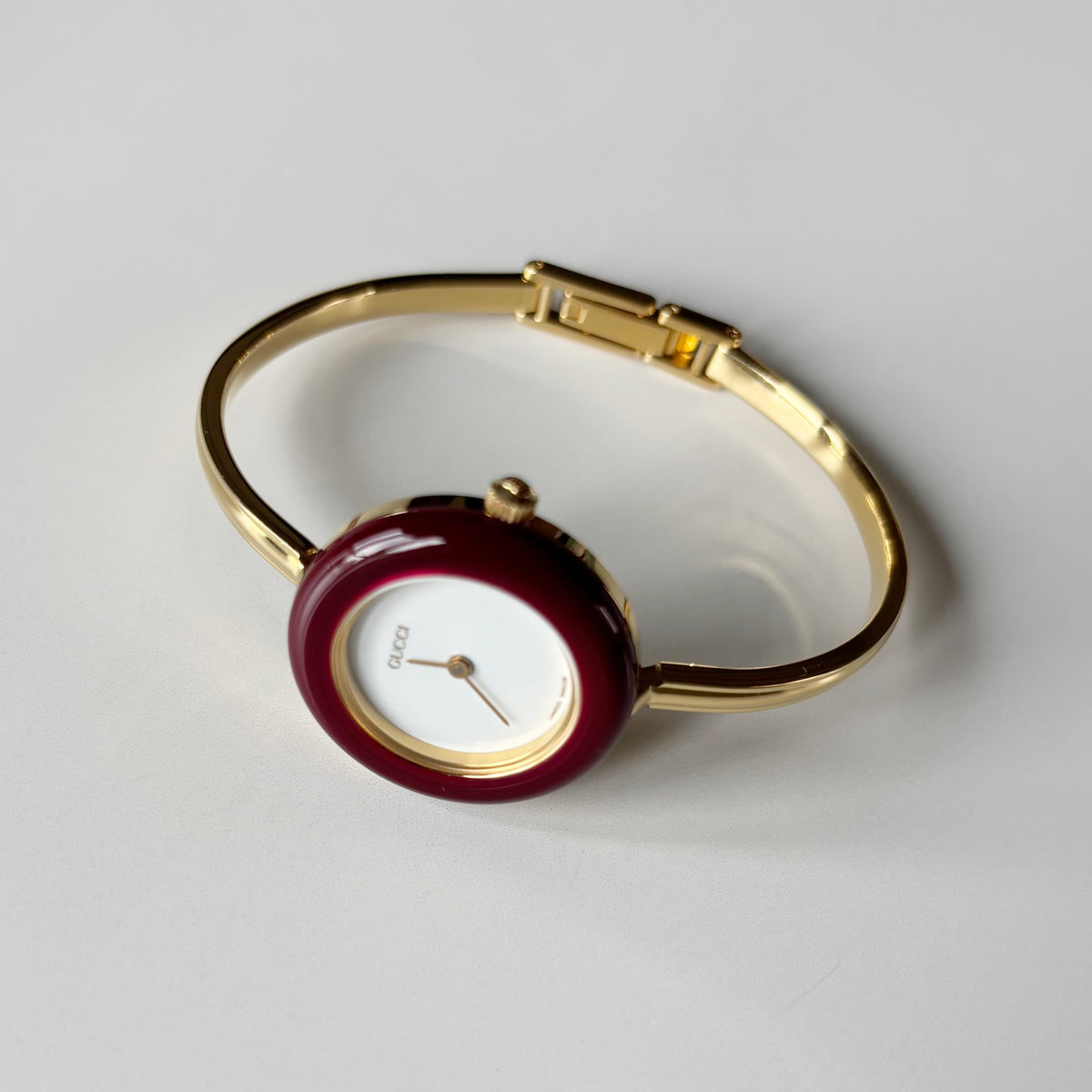 Gucci 1990s Interchangeable Bezel Gold Plated Bangle Watch with 12 bezels, case
