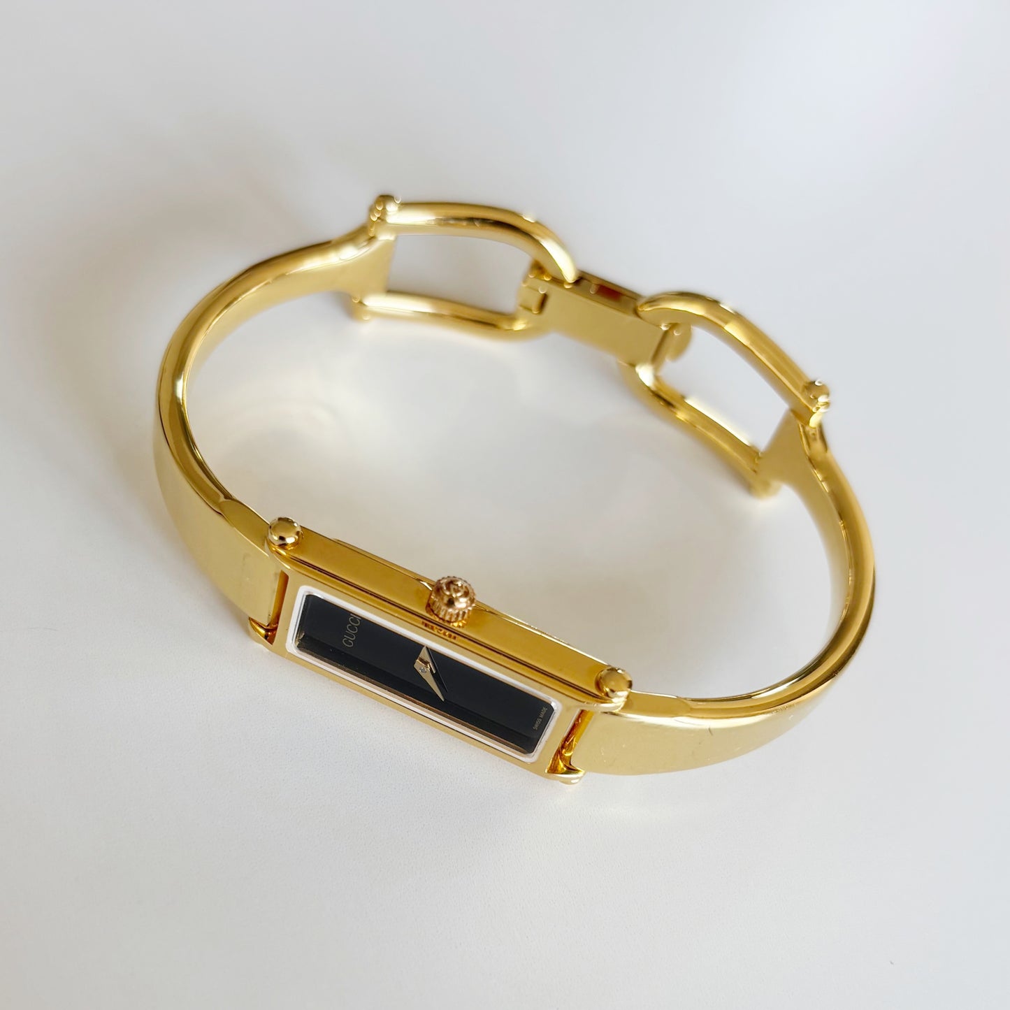 Gucci 1990s Black Rectangular Dial Gold Plated Bangle Watch