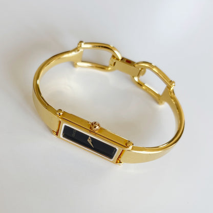 Gucci 1990s Black Rectangular Dial Gold Plated Bangle Watch