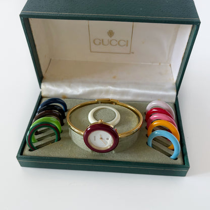 Gucci 1990s Interchangeable Bezel Gold Plated Bangle Watch with 12 bezels, case