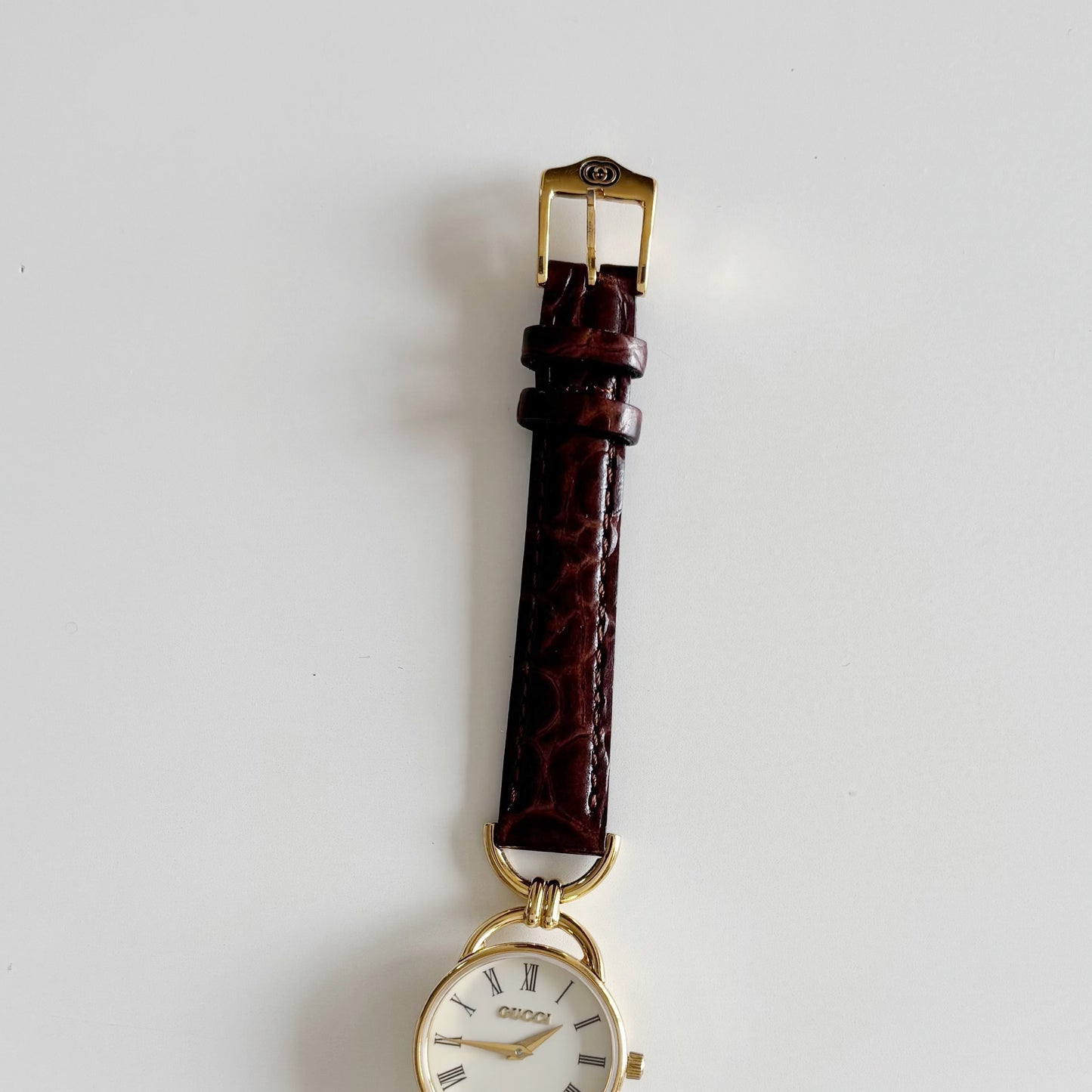 Gucci 1990s Round Dial Gold Plated Horsebit Watch