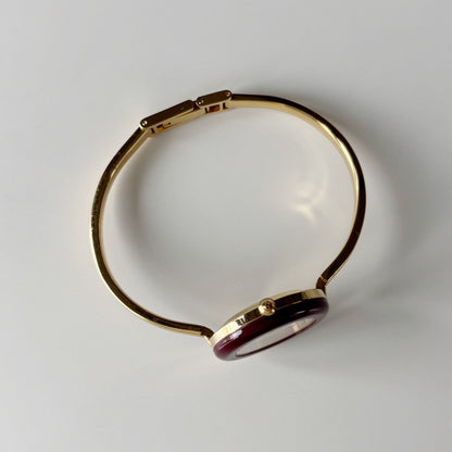 Gucci 1990s Interchangeable Bezel Gold Plated Bangle Watch with 12 bezels, case