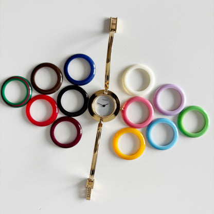 Gucci 1990s Interchangeable Bezel Gold Plated Bangle Watch with 12 bezels, case