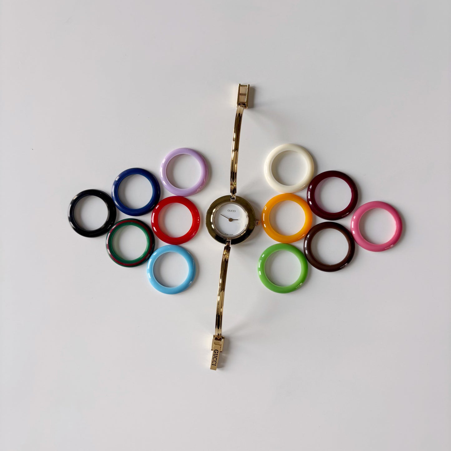 Gucci 1990s Interchangeable Bezel Gold Plated Bangle Watch with case, 12 bezels