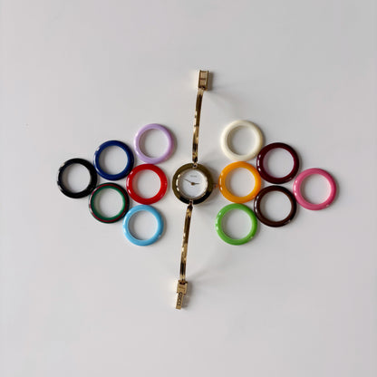 Gucci 1990s Interchangeable Bezel Gold Plated Bangle Watch with case, 12 bezels