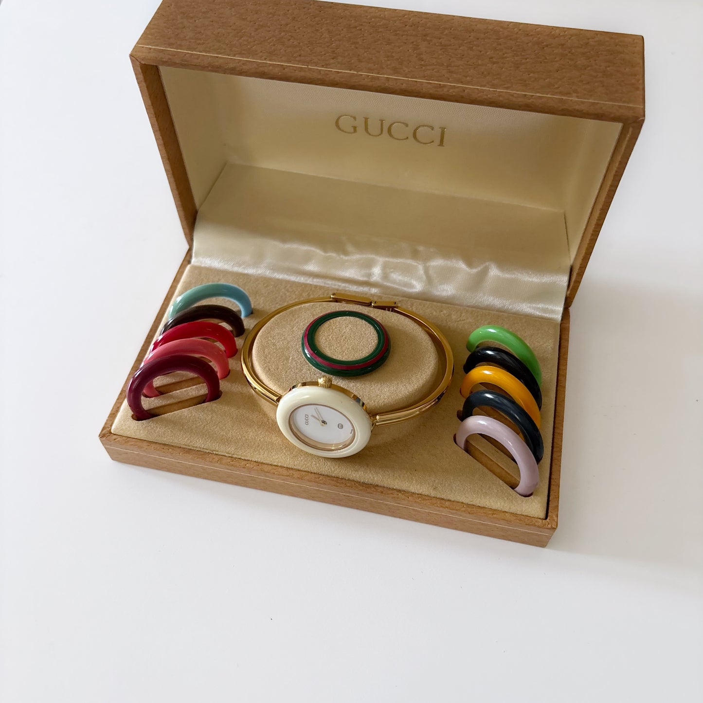 Gucci 1990s Interchangeable Bezel Gold Plated Bangle Watch with 12 bezels, case