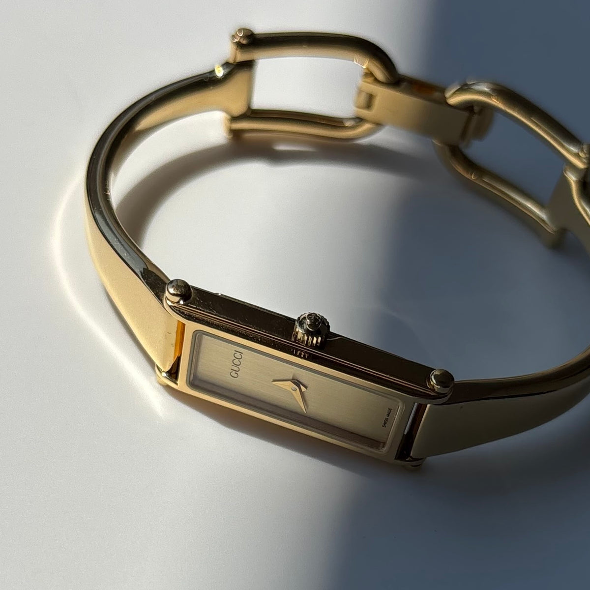 Gucci 1990s Gold Rectangular Dial Gold Plated Bangle Watch