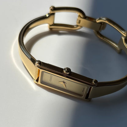 Gucci 1990s Gold Rectangular Dial Gold Plated Bangle Watch