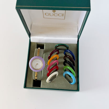 Gucci 1990s Interchangeable Bezel Gold Plated Bangle Watch with 12 bezels, case