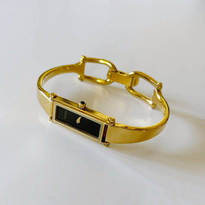 Gucci 1990s Rectangular Black Dial Gold Plated Bangle Watch