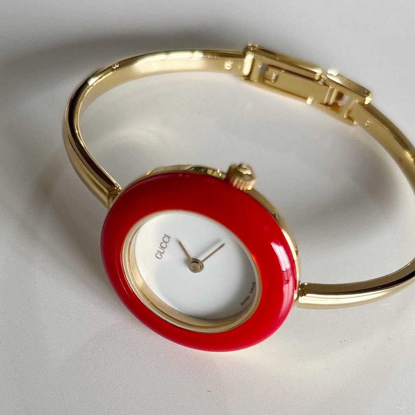 Gucci 1990s Interchangeable Bezel Gold Plated Bangle Watch with case, 12 bezels (Small)