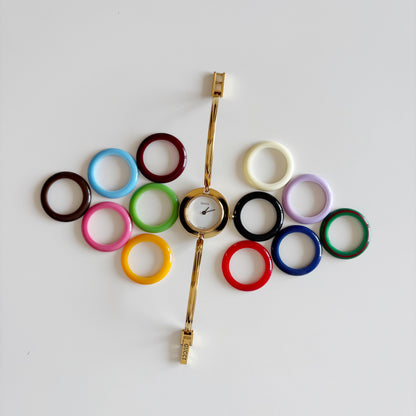 Gucci 1990s Interchangeable Bezel Gold Plated Bangle Watch with 12 bezels, case