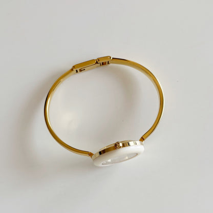 Gucci 1990s Interchangeable Bezel Gold Plated Bangle Watch with 12 bezels, case