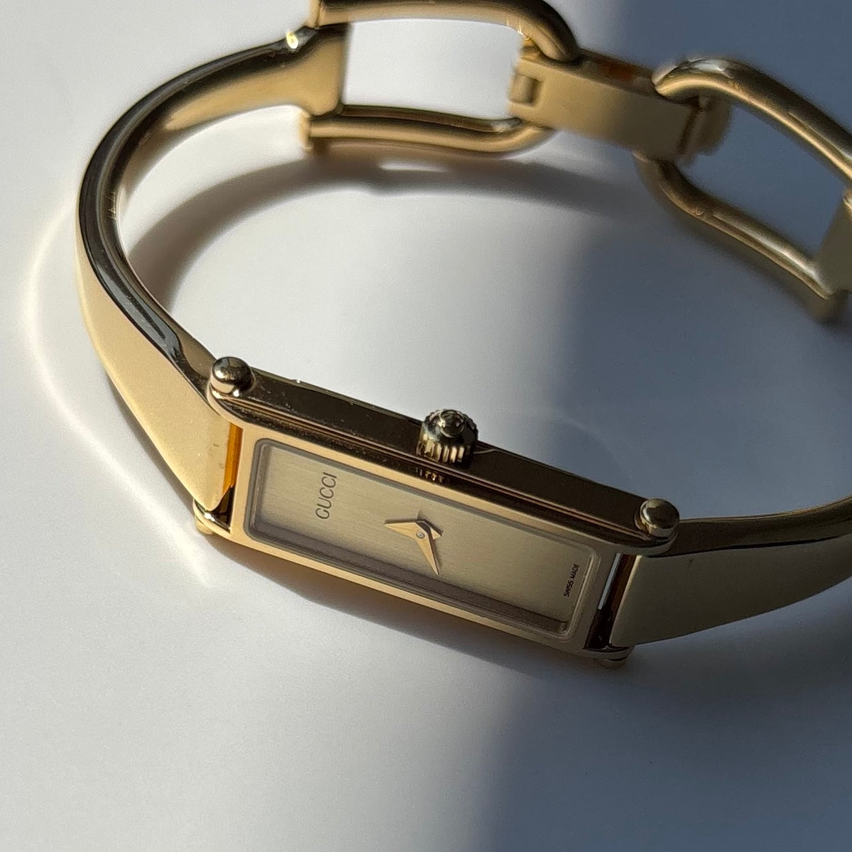 Gucci 1990s Gold Rectangular Dial Gold Plated Bangle Watch