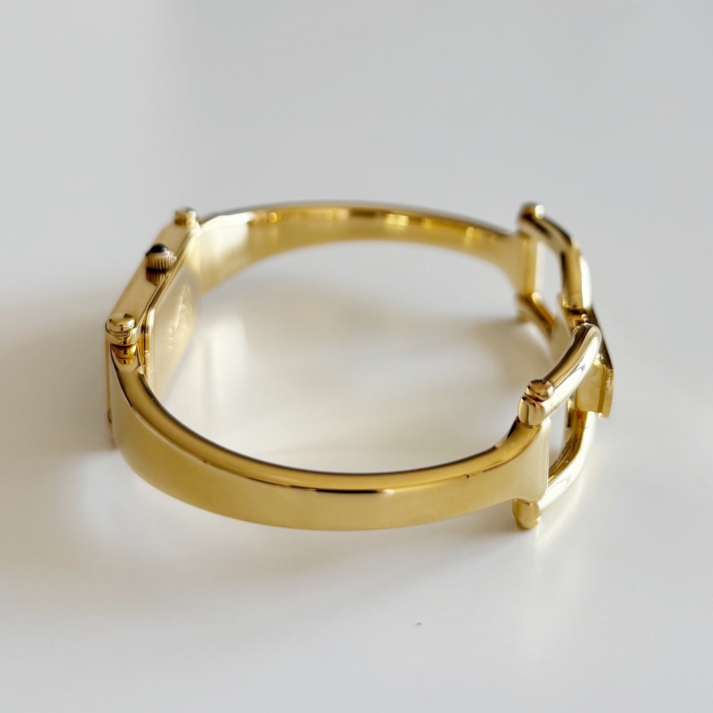 Gucci 1990s Rectangular Gold Dial Gold Plated Bangle Watch