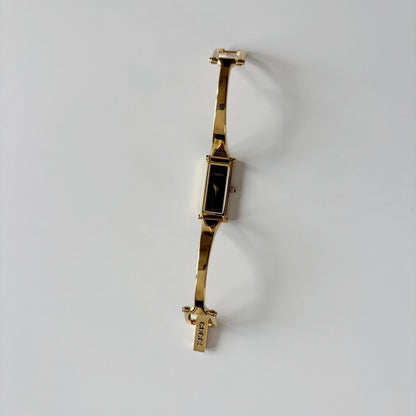 Gucci 1990s Black Rectangular Dial Gold Plated Bangle Watch
