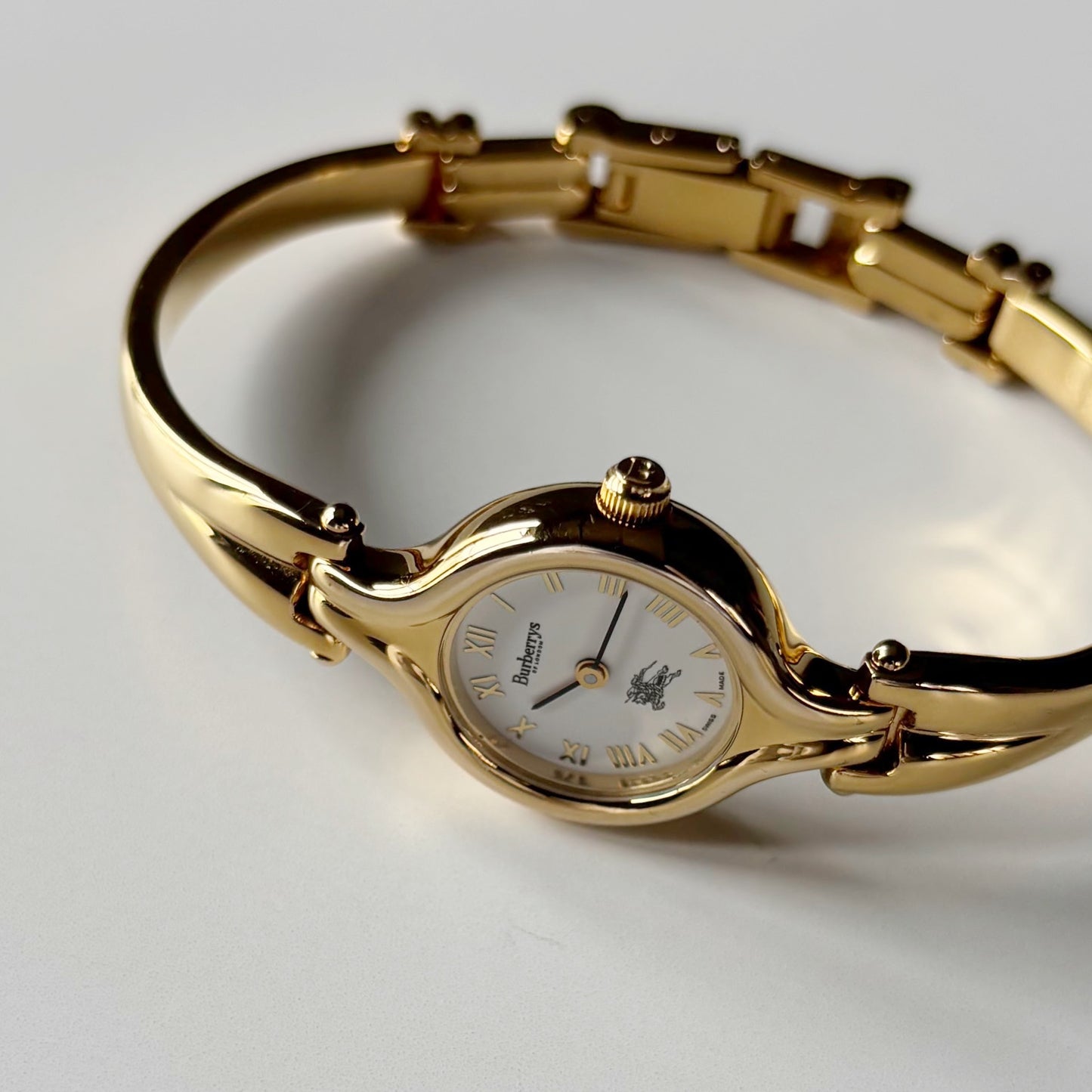Burberry 1990s Round Dial Gold Plated Bangle Watch
