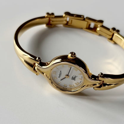 Burberry 1990s Round Dial Gold Plated Bangle Watch
