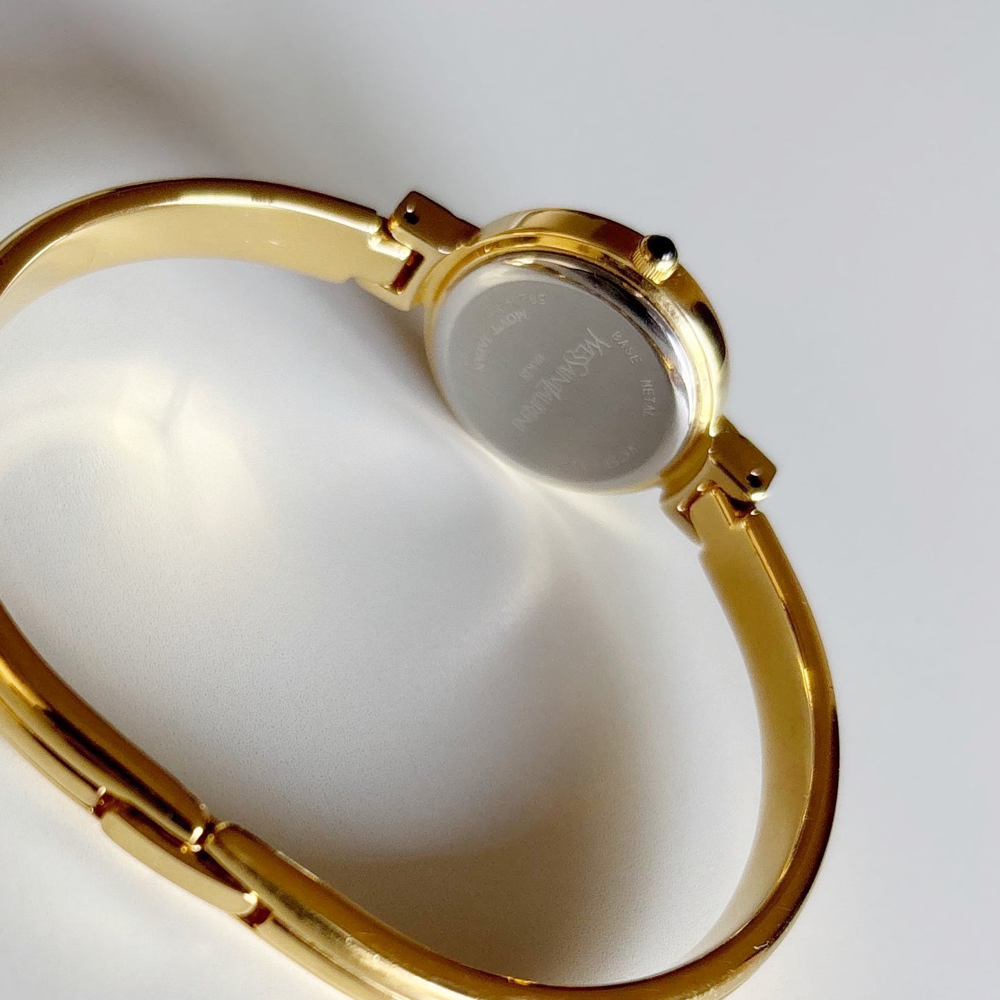 Yves Saint Laurent 1990s Black Round Dial Gold Plated Bangle Watch