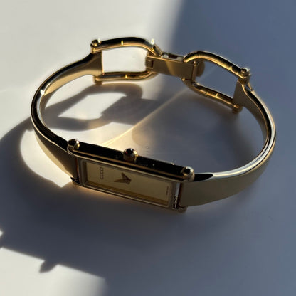 Gucci 1990s Rectangular Dial Gold Plated Bangle Watch