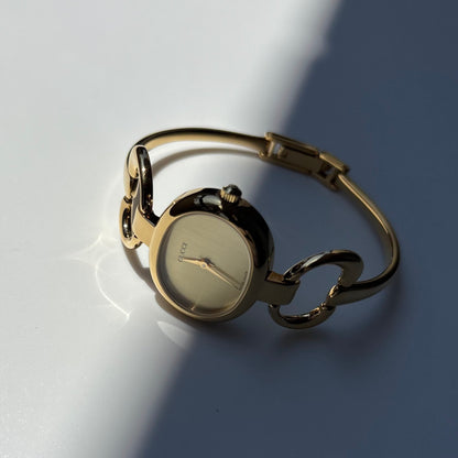 Gucci 1990s Oval Dial Gold Plated Bangle Watch