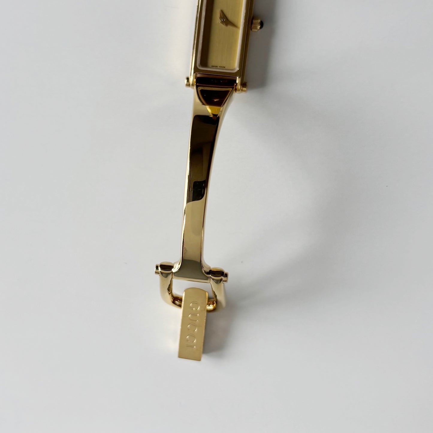 Gucci 1990s Gold Rectangular Dial Gold Plated Bangle Watch