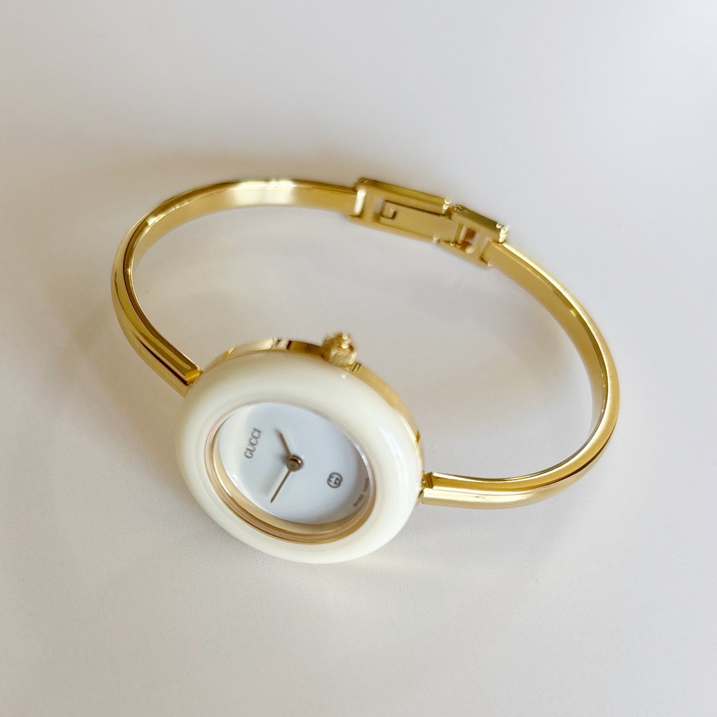 Gucci 1990s Interchangeable Bezel Gold Plated Bangle Watch with 12 bezels, case