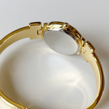 Givenchy 1990s Black Round Dial Gold Plated Bangle Watch