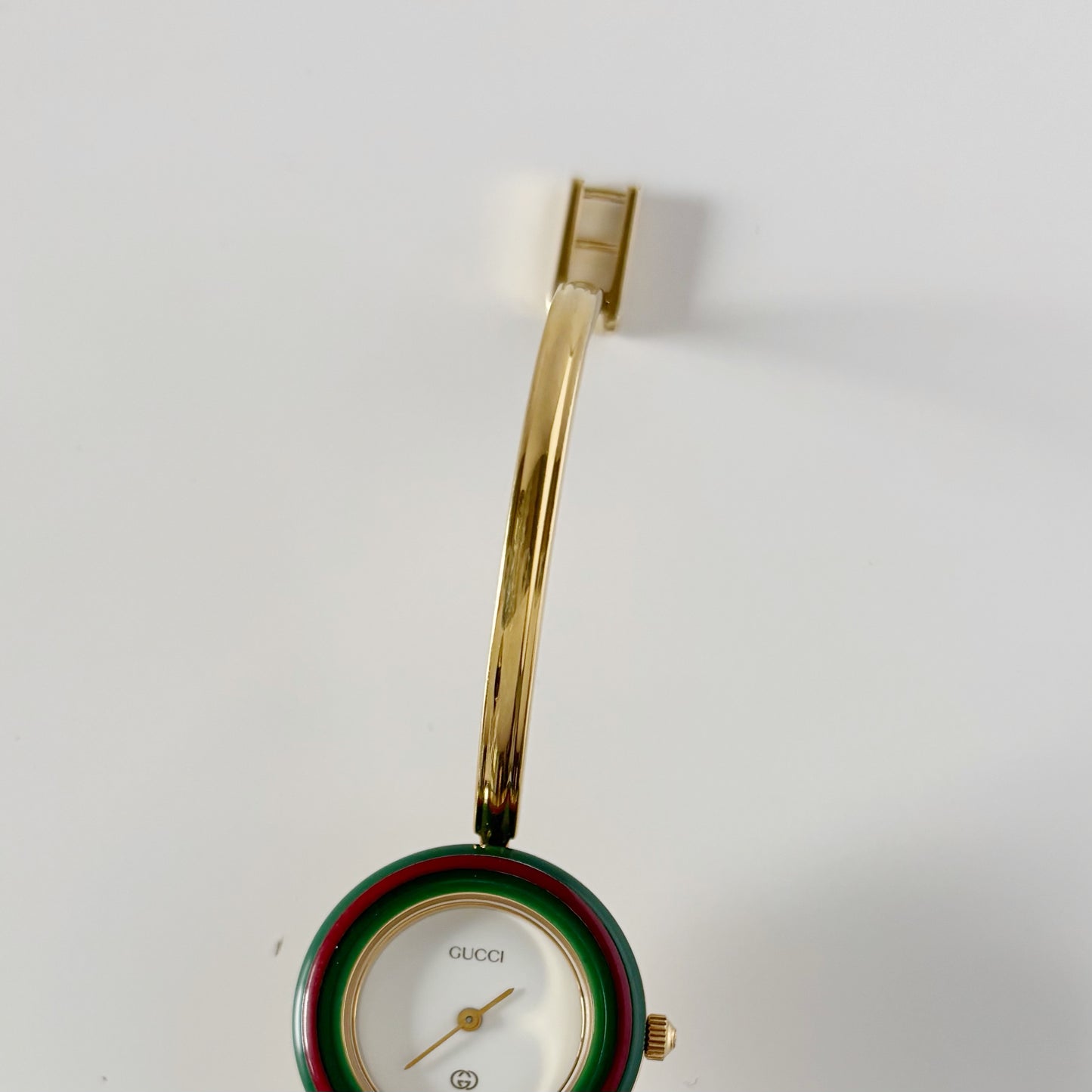 Gucci 1990s Interchangeable Bezel Gold Plated Bangle Watch with 12 bezels, case