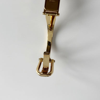 Gucci 1990s Gold Rectangular Dial Gold Plated Bangle Watch
