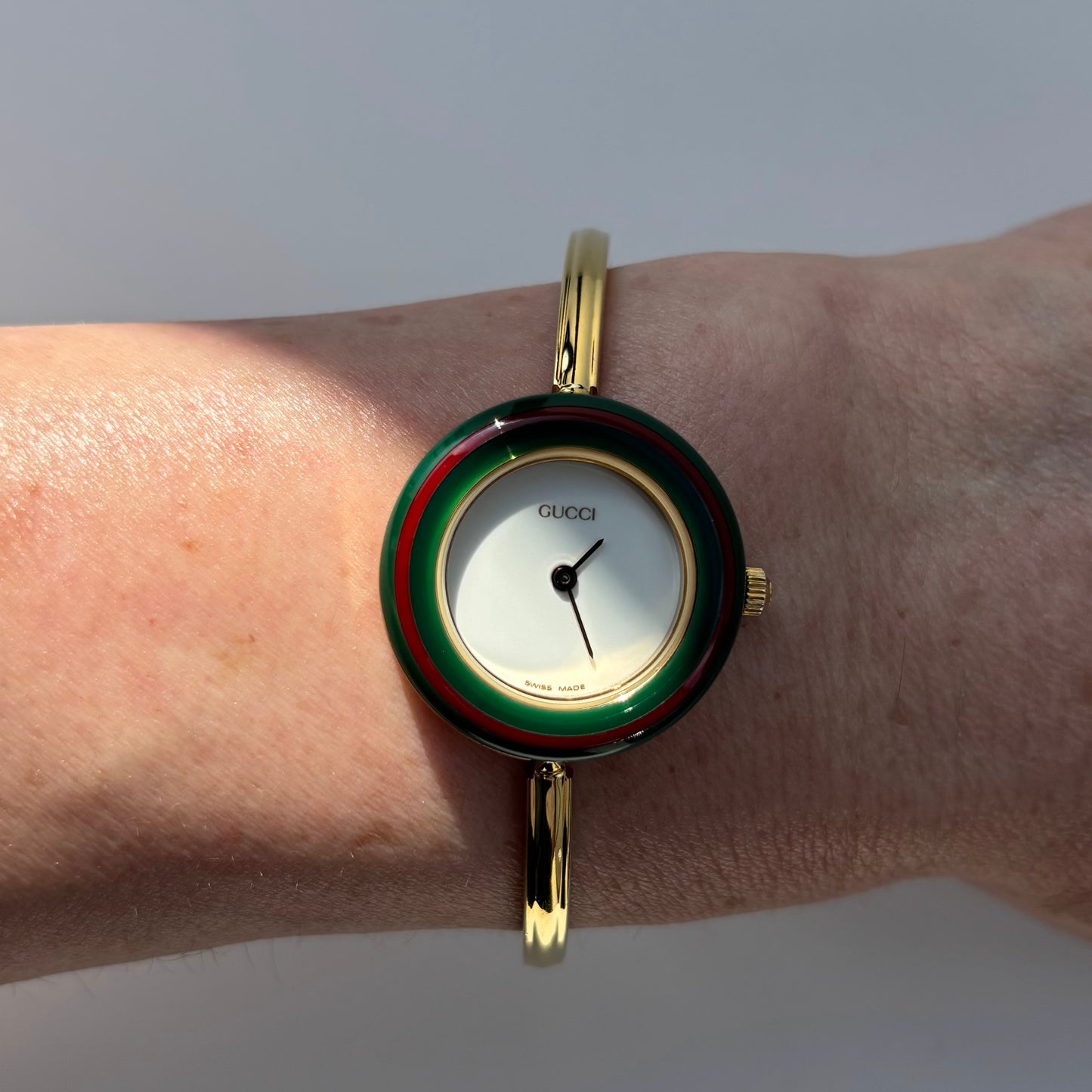 Gucci 1990s Interchangeable Bezel Gold Plated Bangle Watch with 12 bezels, case