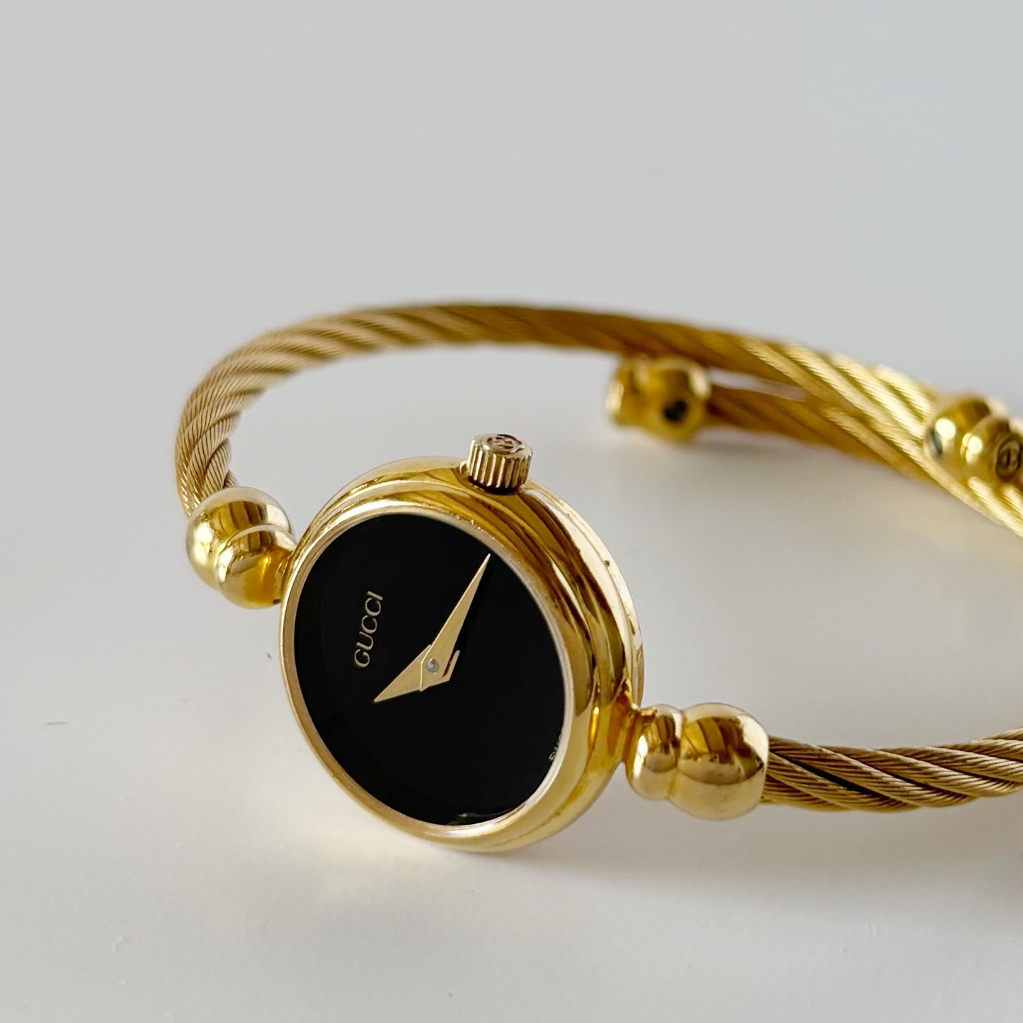 Gucci 1990s Black Dial Gold Plated Cable Bangle Watch