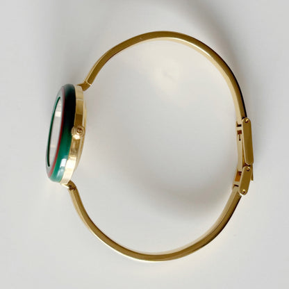 Gucci 1990s Interchangeable Bezel Gold Plated Bangle Watch with 12 bezels, case