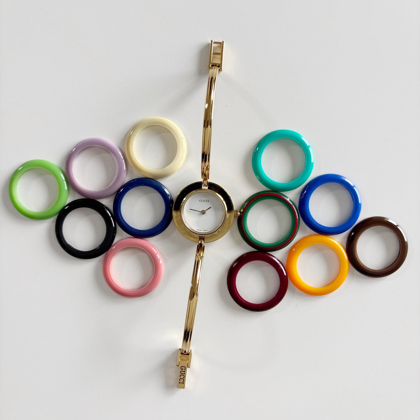 Gucci 1990s Interchangeable Bezel Gold Plated Bangle Watch with 12 bezels, case