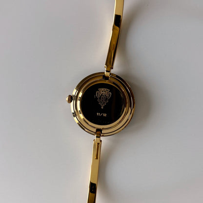 Gucci 1990s Interchangeable Bezel Gold Plated Bangle Watch with 12 bezels, case