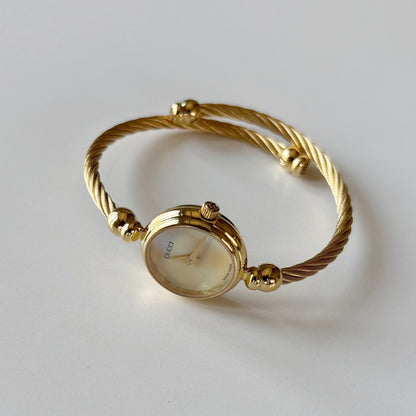 Gucci 1990s Seashell Dial Gold Plated Cable Bangle Watch