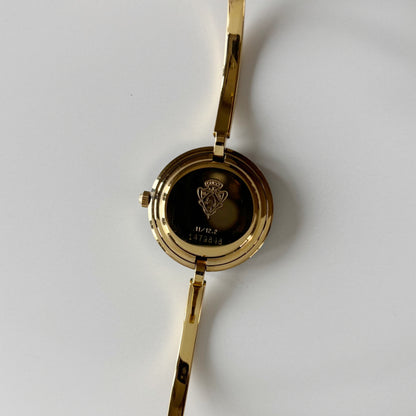 Gucci 1990s Interchangeable Bezel Gold Plated Bangle Watch with 12 bezels, case