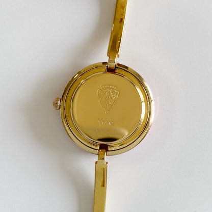 Gucci 1990s Interchangeable Bezel Gold Plated Bangle Watch with 12 bezels, case