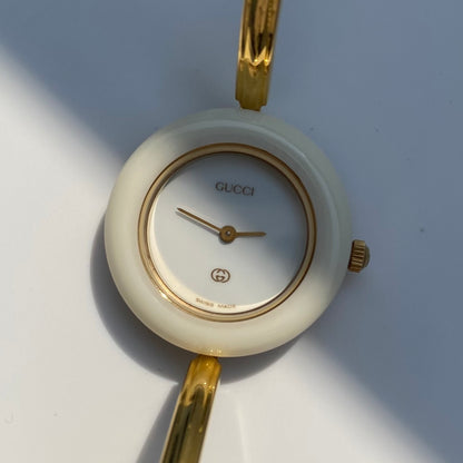 Gucci 1990s Interchangeable Bezel Gold Plated Bangle Watch with 12 bezels, case