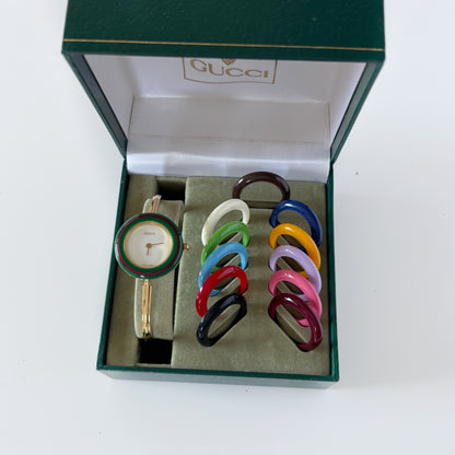 Gucci 1990s Interchangeable Bezel Gold Plated Bangle Watch with 12 bezels, case