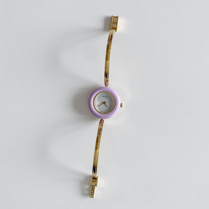 Gucci 1990s Interchangeable Bezel Gold Plated Bangle Watch with 12 bezels, case