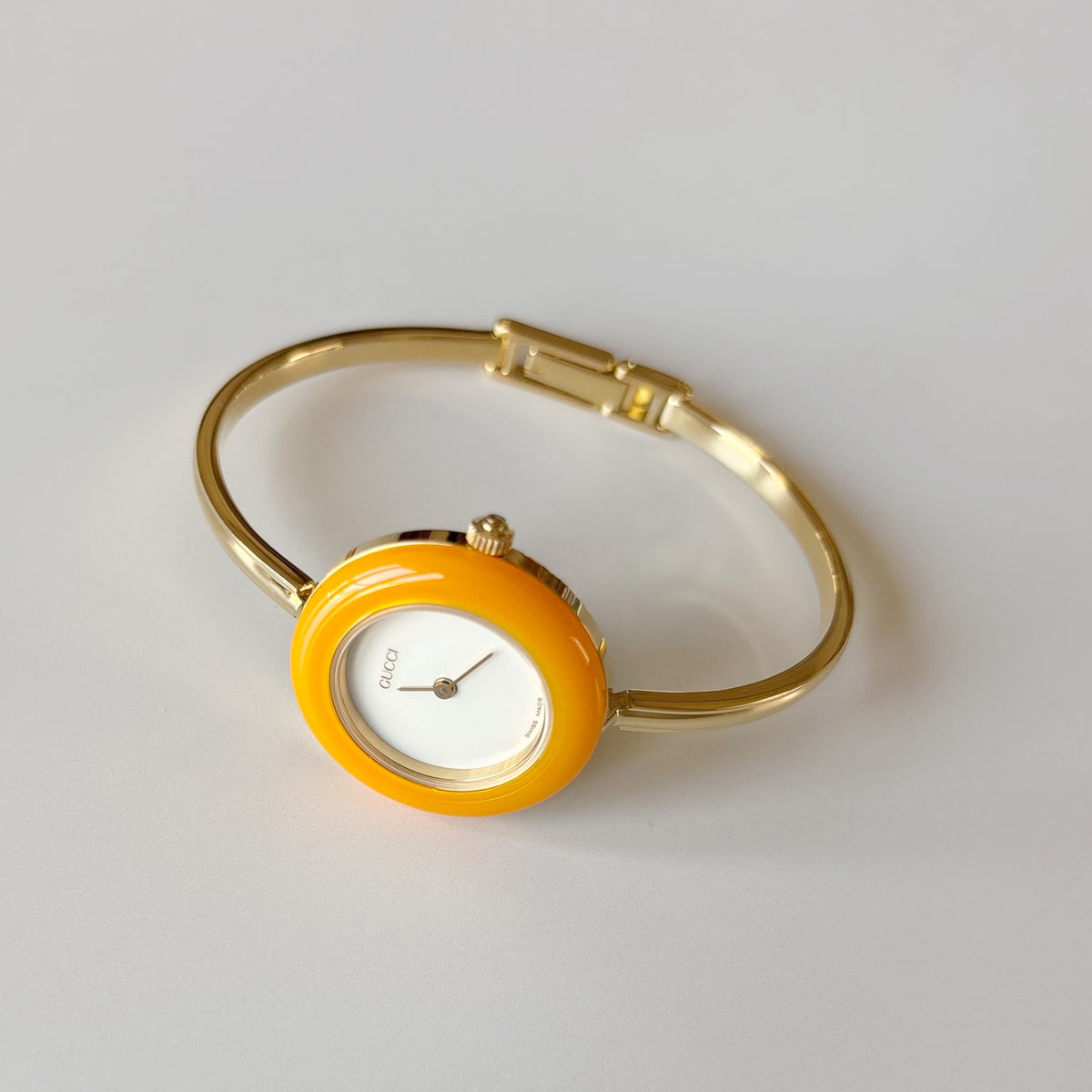 Gucci 1990s Interchangeable Bezel Gold Plated Bangle Watch with 12 bezels, case