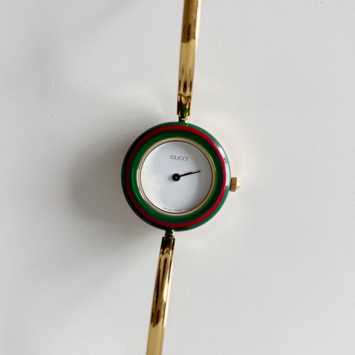Gucci 1990s Interchangeable Bezel Gold Plated Bangle Watch with 12 bezels, case (Small)